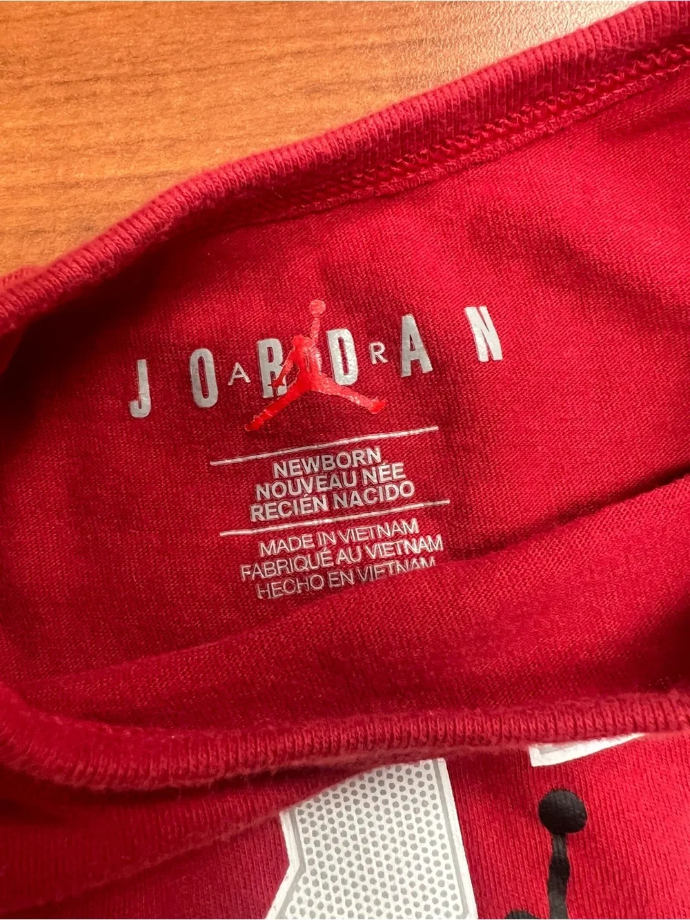 Jordan Red Newborn Bodysuit with White Accents